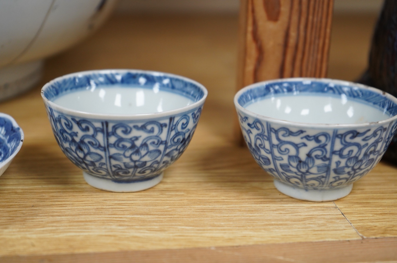 An 18th/19th century Chinese tea bowl and saucer, a punch bowl, two tea bowls and a Paris porcelain vase, largest 31cm